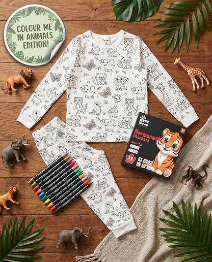 Animal colour-in pyjama set with washable fabric pens laid out on a wooden table.