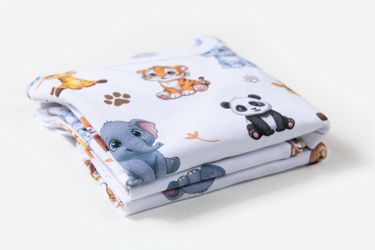 Close-up of the colourful Zoo animal print featuring Elephant, Panda, giraffes and tigers on soft cotton fabric