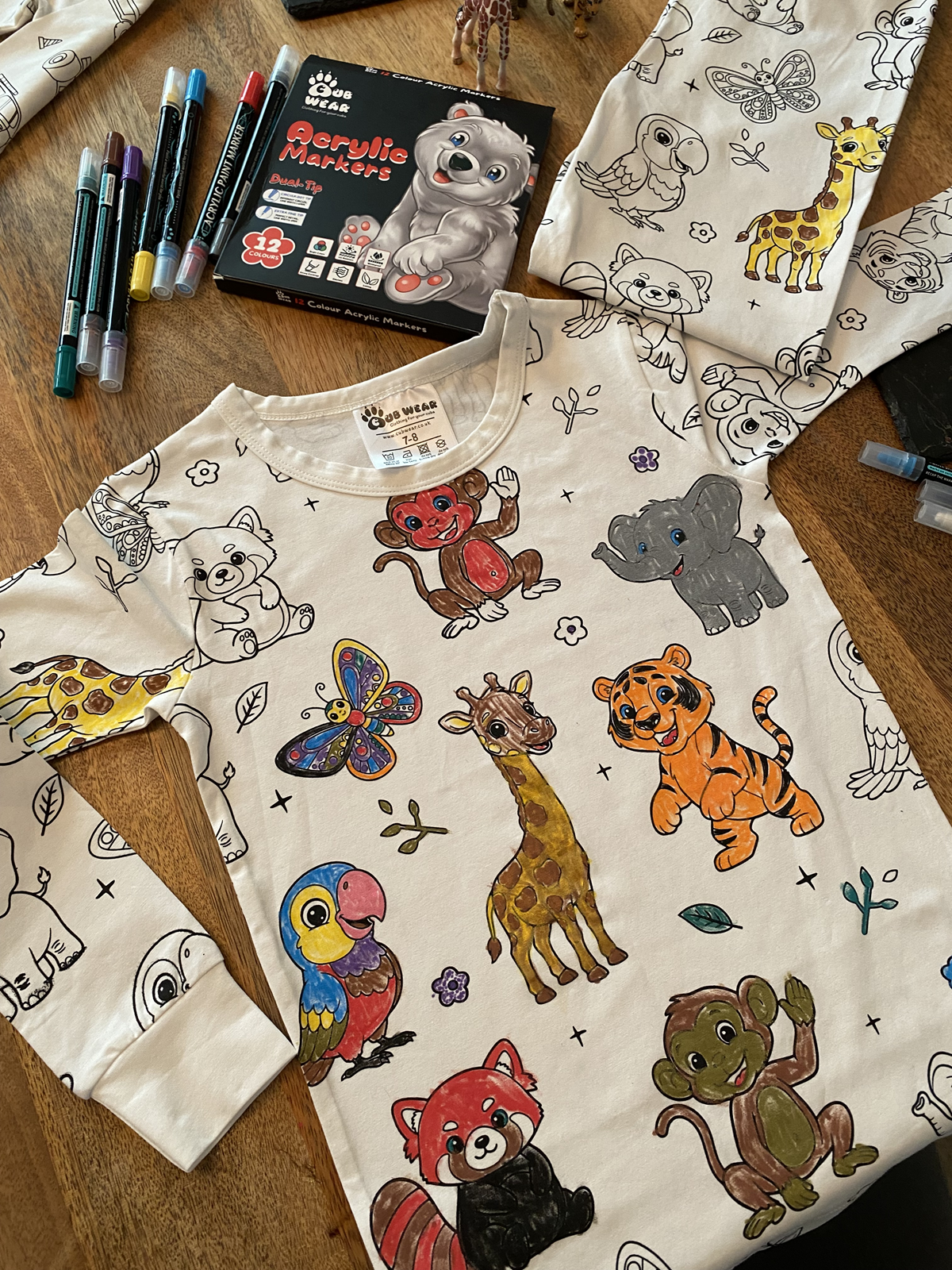 Animal colour-in pyjamas and fabric pens creating a fun personalised activity for children.