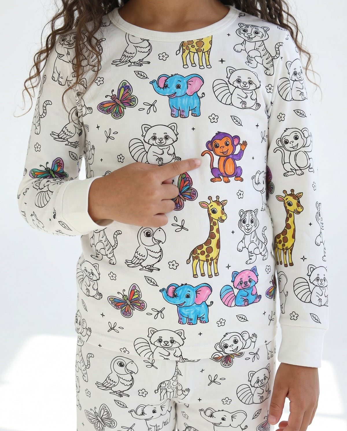 Kids animal colour-in pyjamas featuring lions, giraffes, elephants and jungle animals.