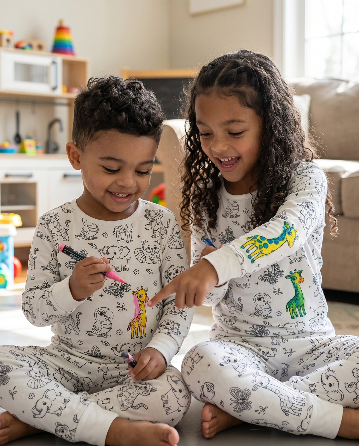 Children wearing personalised animal colour-in pyjamas after decorating them with fabric pens.