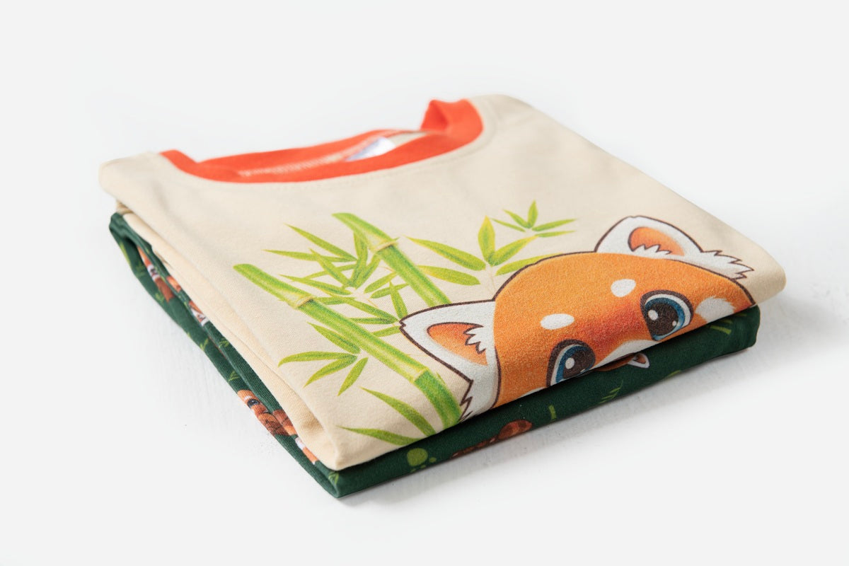 Folded Red Panda children's pyjamas showing premium cotton fabric and cute character design