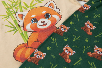 Close-up of Red Panda pyjama trousers featuring playful red panda and bamboo print