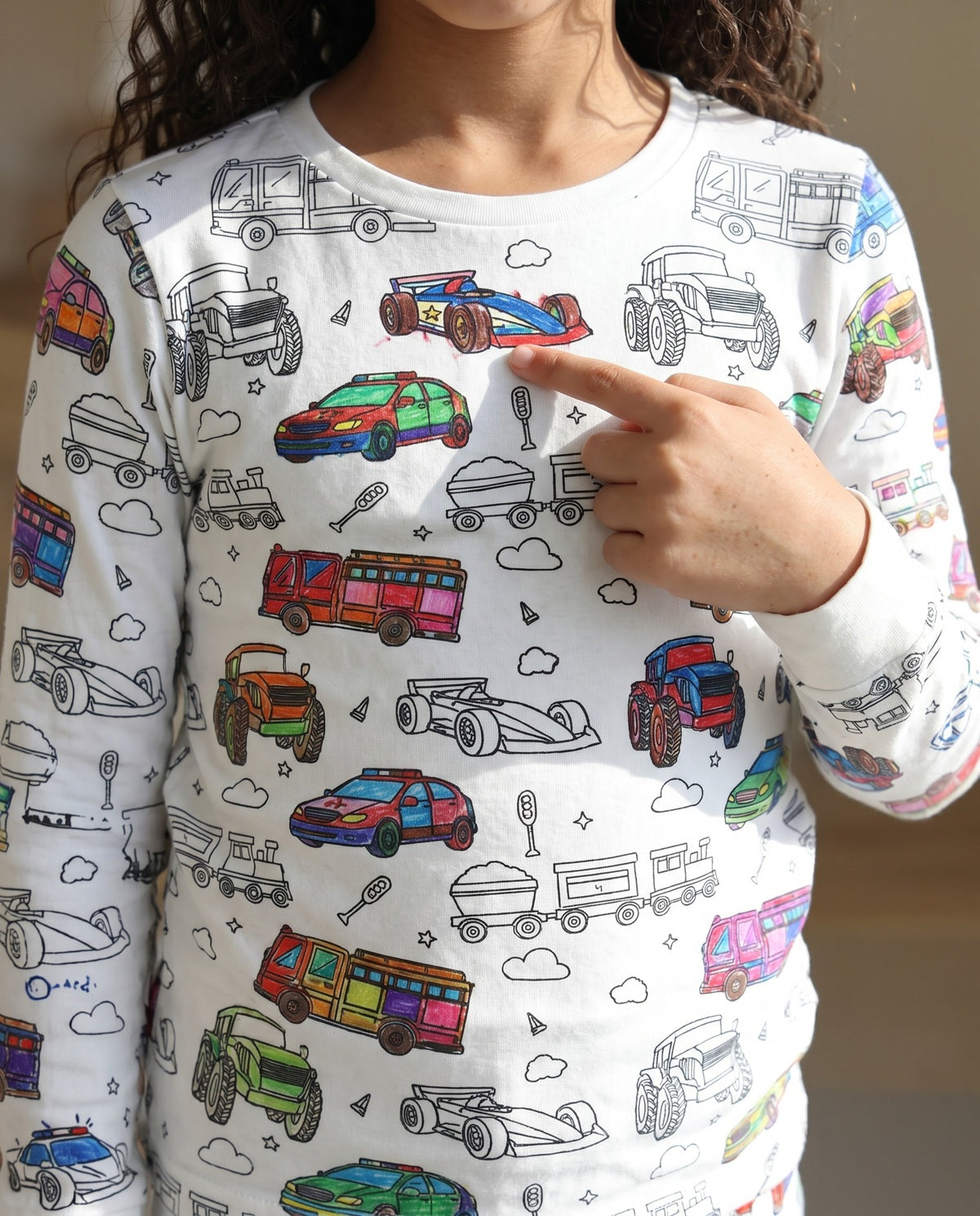 Kids Vehicles Colour-In Pyjamas featuring cars, trucks, diggers, tractors and emergency vehicles.